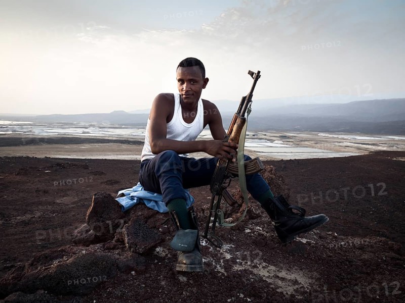 Man with rifle secures terrain