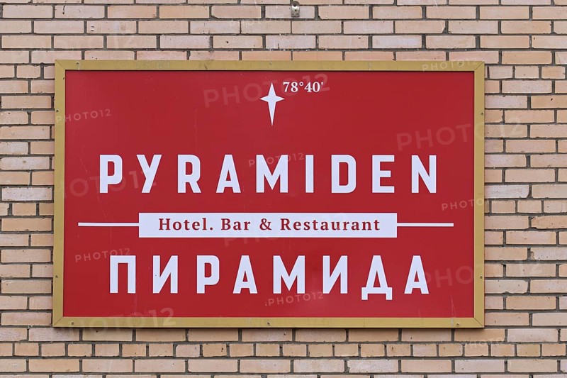 Red sign on wall of hotel bar restaurant at Pyramiden