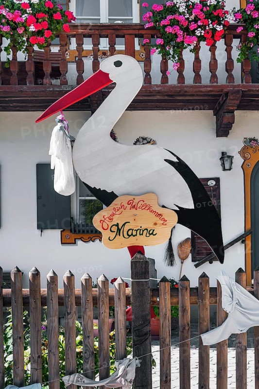 Stork figure with birth announcement
