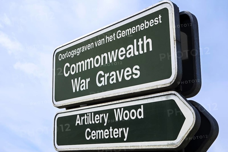 Signpost for military cemetery of the Commonwealth War Graves Commission burial ground for First World War One British soldiers in West Flanders