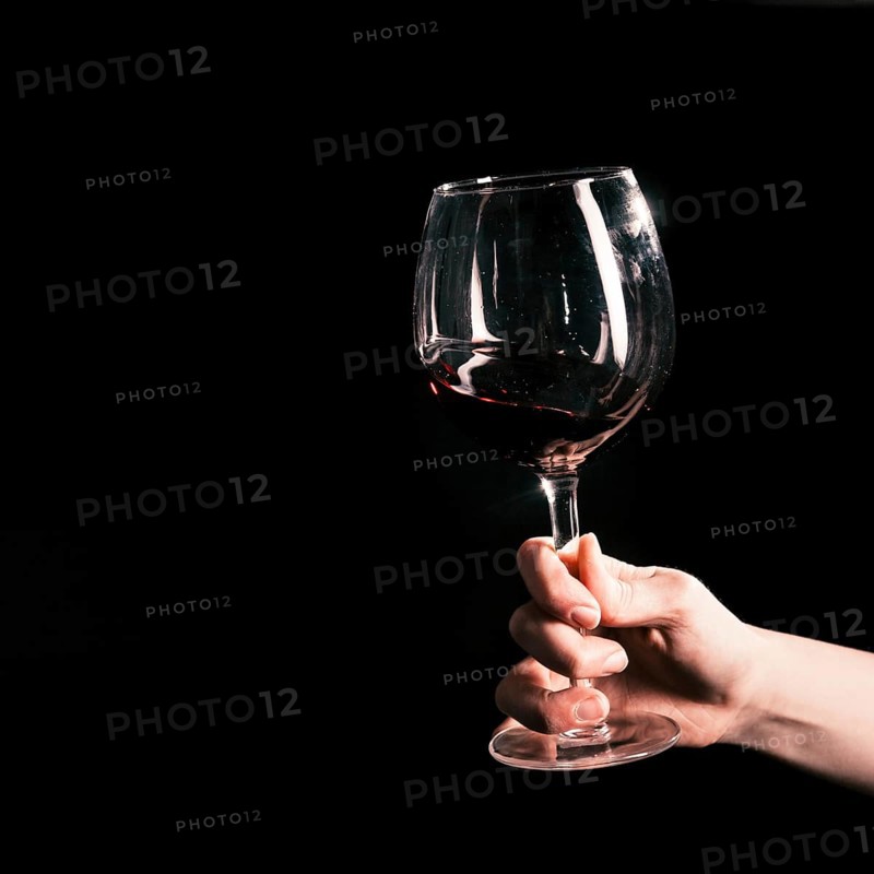 Crop hand with wineglass