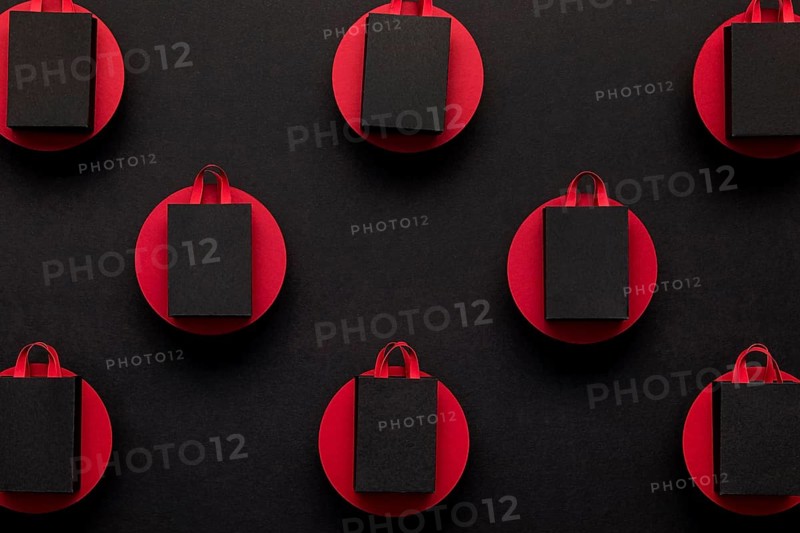 Black shopping bags red dots top view