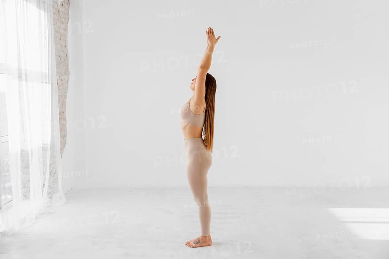 Full shot woman standing one leg