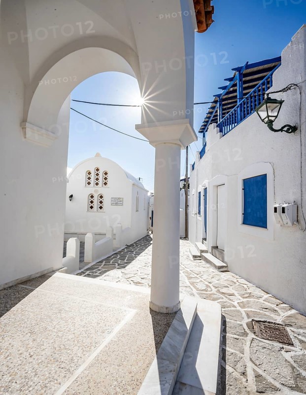 Chapel of Agios Antonios and archway with sun star of the Greek Orthodox church of Metamorfosi Sotiros