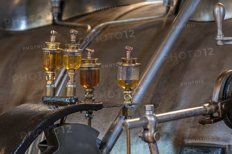 Glass cylinder on historical steam engine