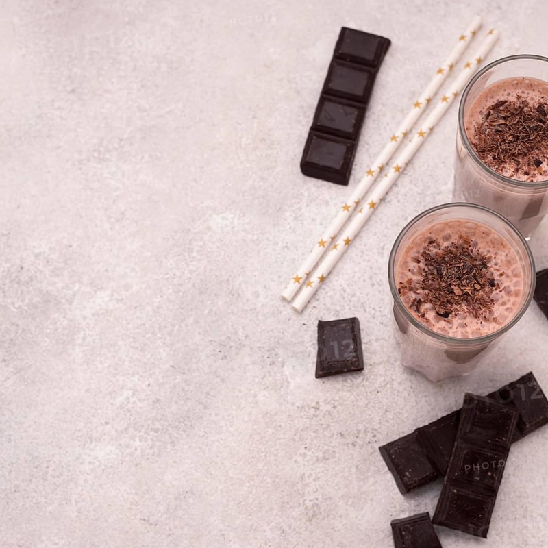 High angle milkshake glasses with chocolate
