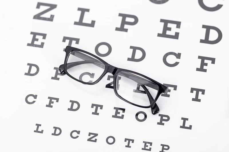 High angle pair glasses with letters