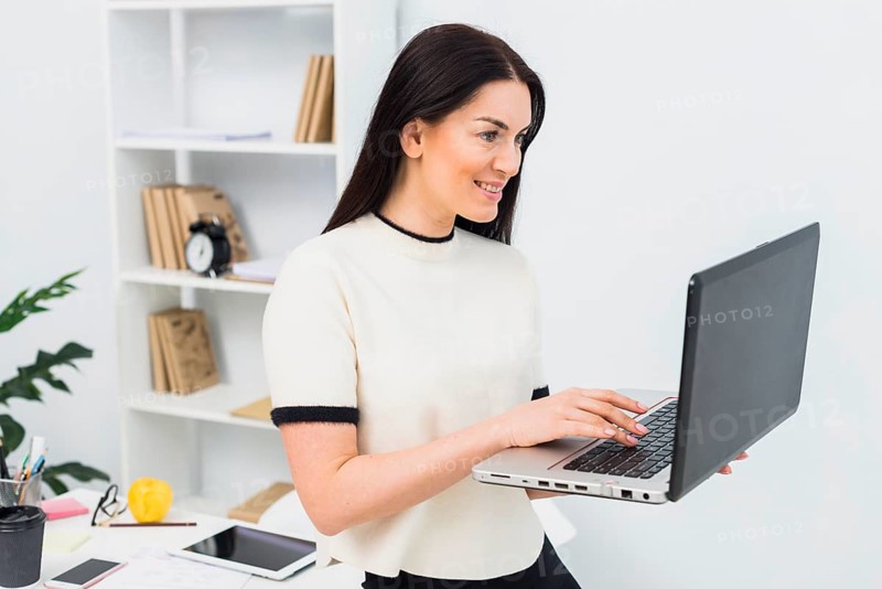 Woman using laptop office