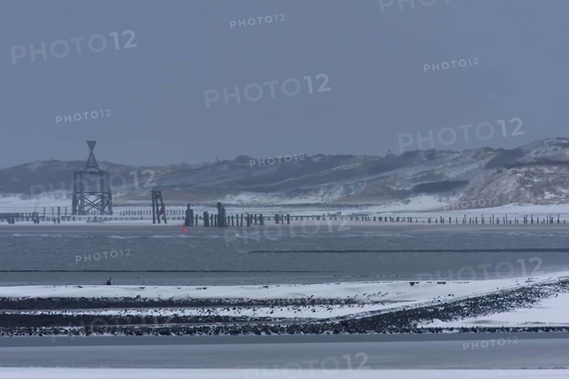 View from the island of Minsener Oog to Wangerooge in winter
