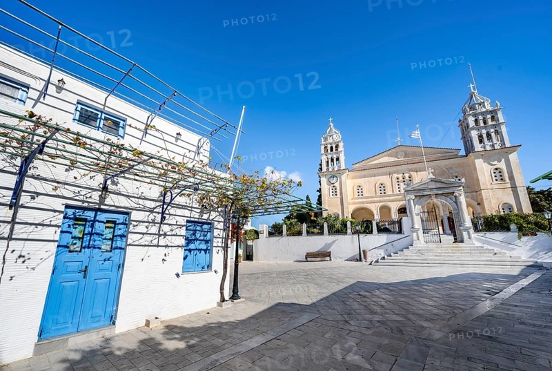 White Cycladic house and church Agia Triada