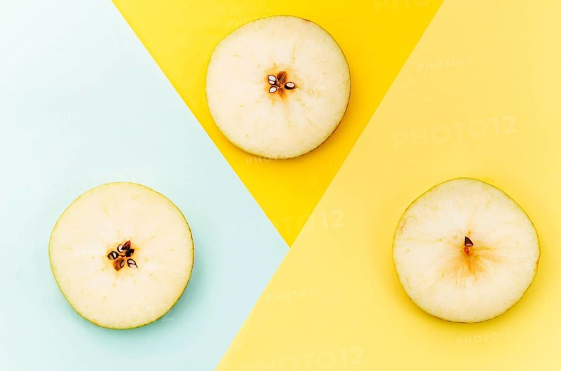 Sliced pear colored background