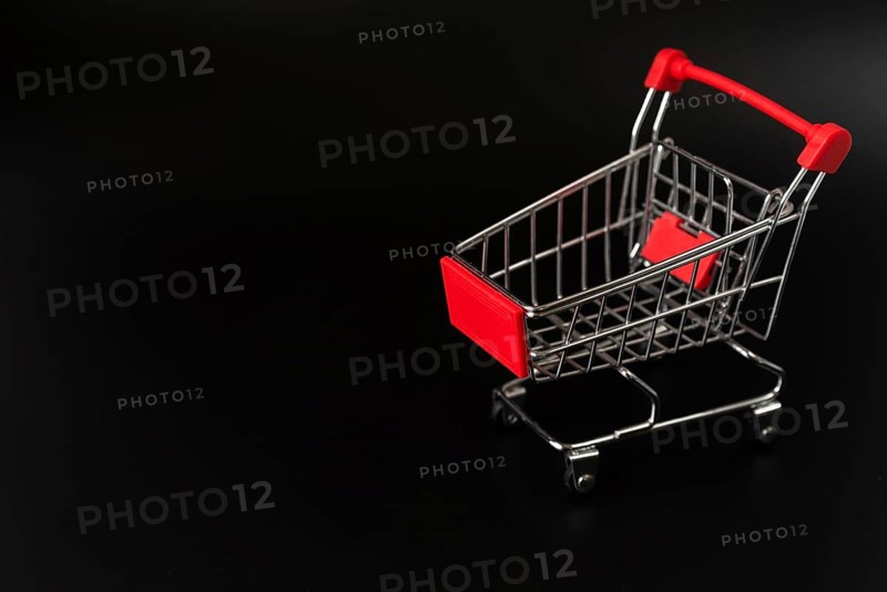 Shopping cart dark background with copy space