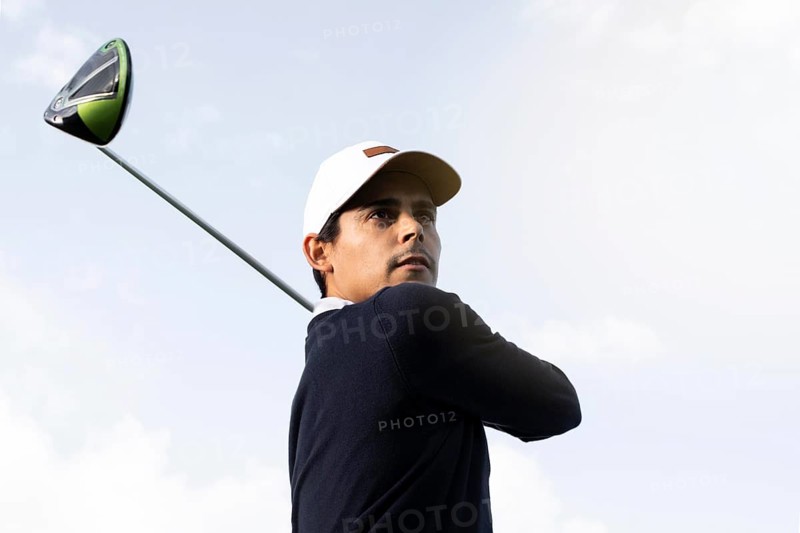 Low angle man with golf club