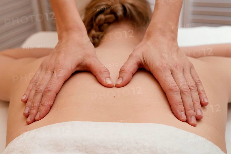 Close up therapist massaging back