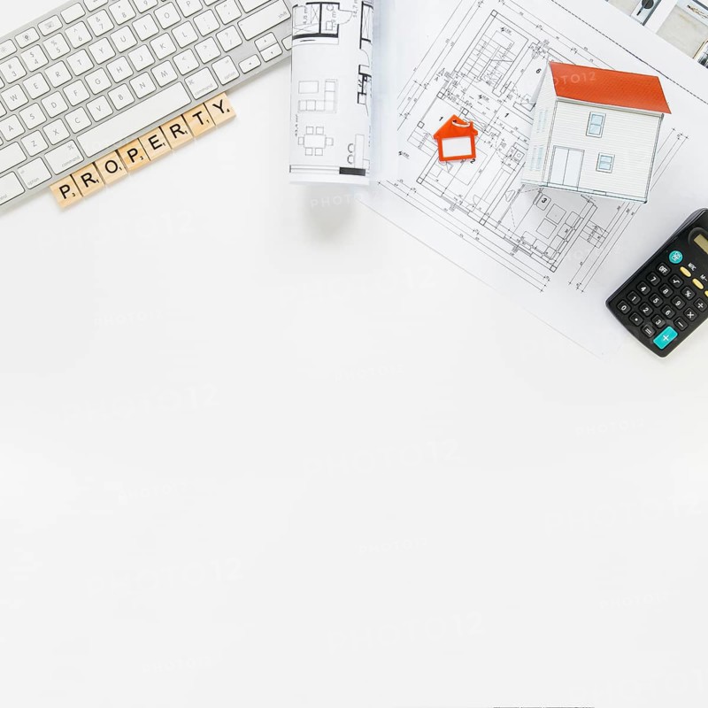 Keyboard with house model blueprint real estate office desk
