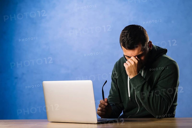 Hacker with desperate tired expression