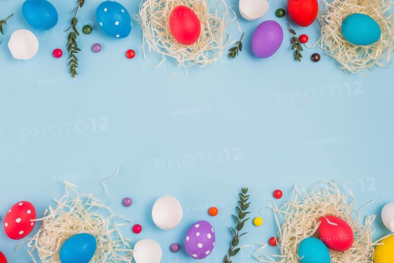 Easter eggs nests with plant branches candies