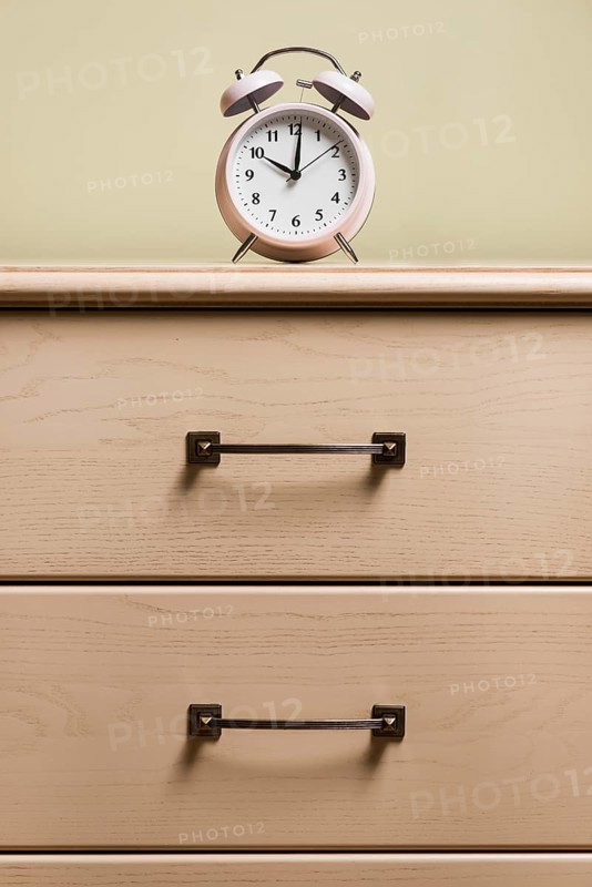 Alarm clock top wooden cabinet