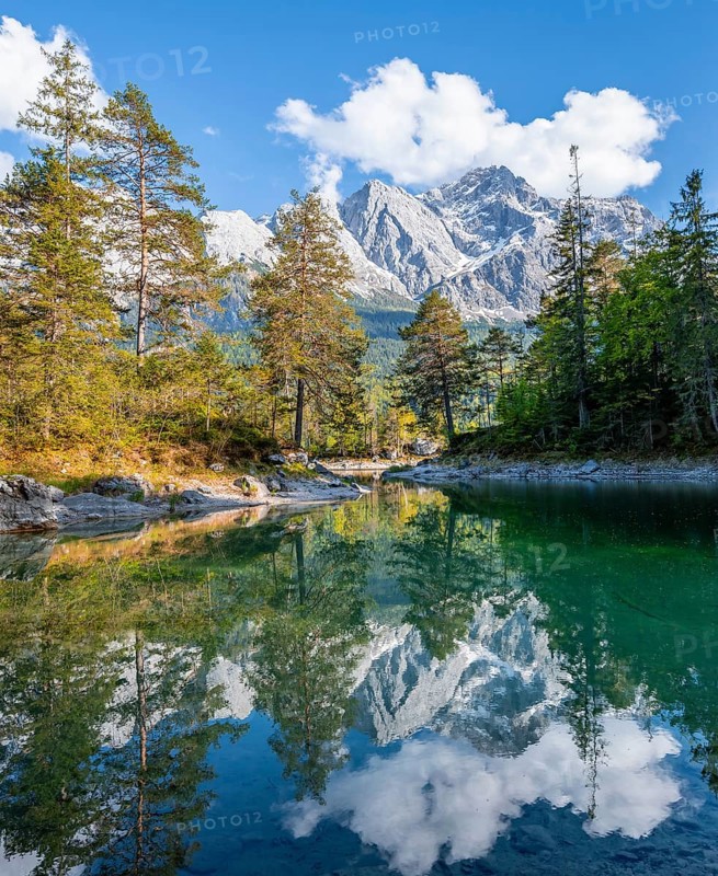 Zugspitze massif and Zugspitze reflected in Eibsee lake