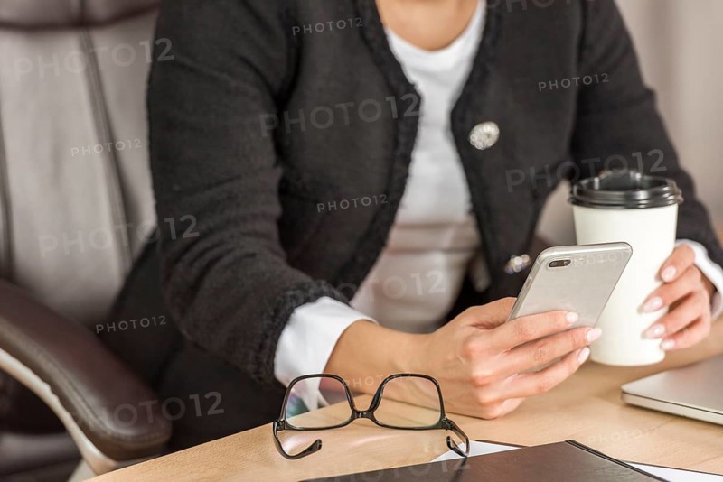 Brunette businesswoman using her mobile phone