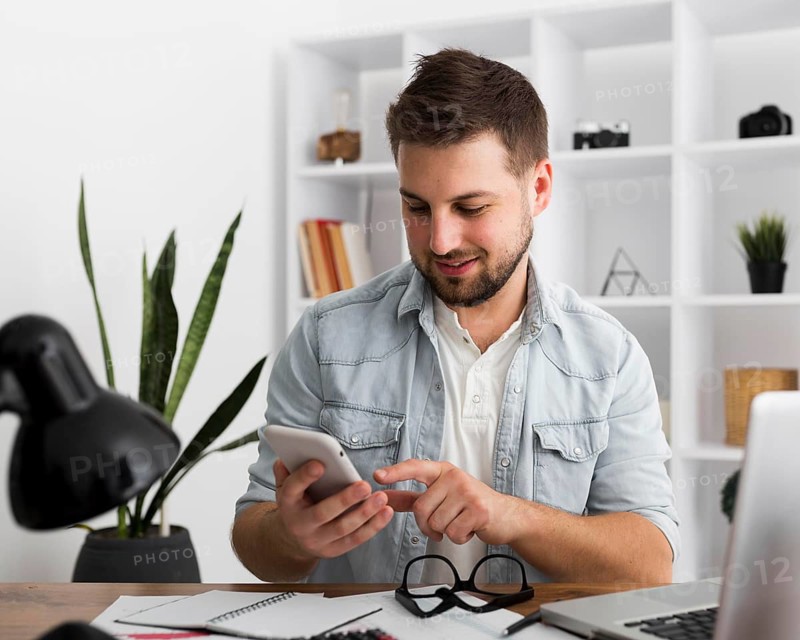 Portrait casual male browsing mobile phone