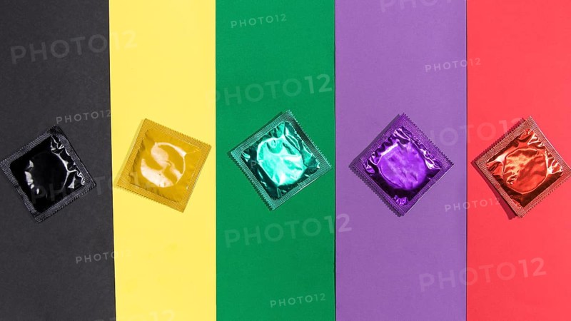 Top view condoms same colour background