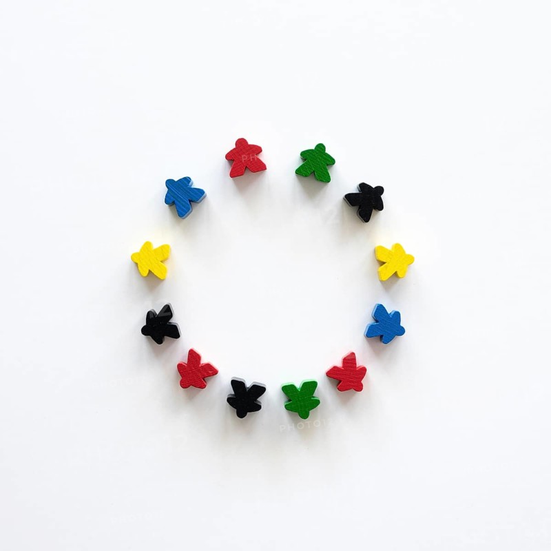 Flat lay meeple board game pieces