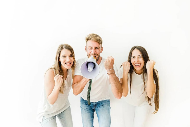 People cheering with megaphone studio