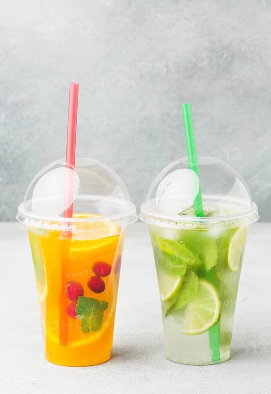 Front view cups with soft drinks straws