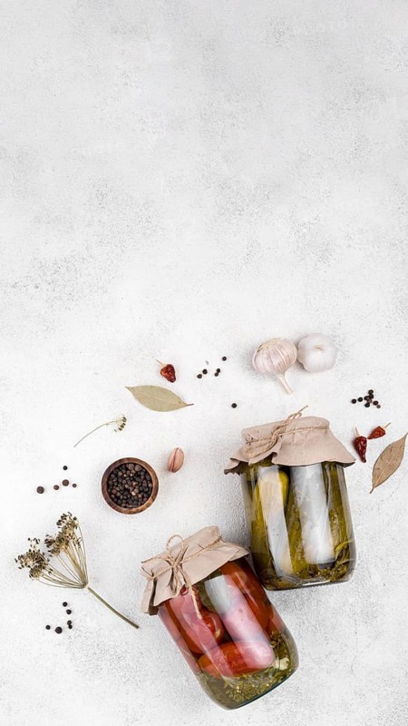 Jars with pickled vegetables copy space