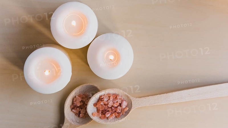 Flaming candles near salt