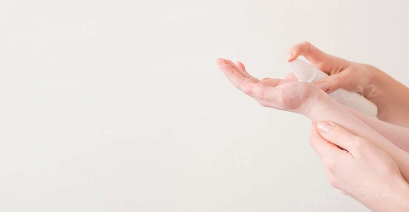Mom son using hand sanitizer
