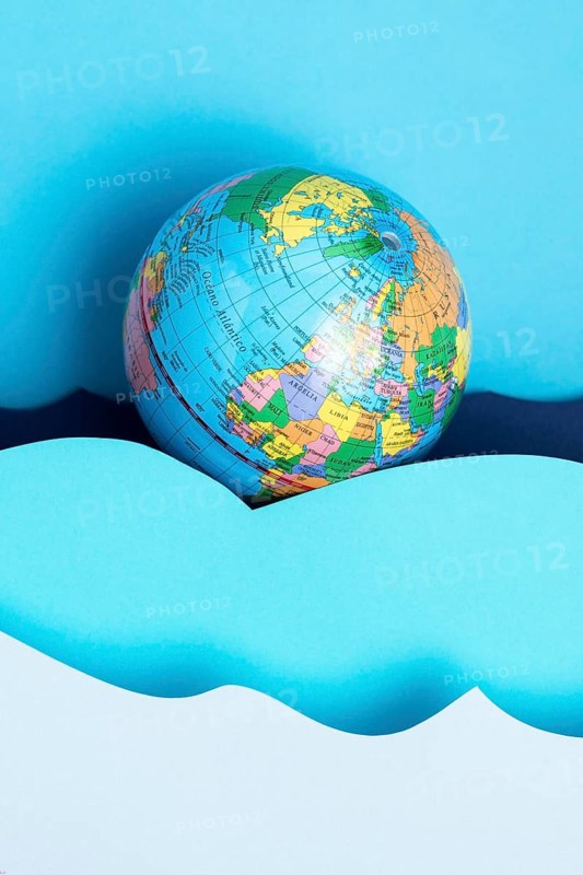 Top view earth globe with paper ocean waves