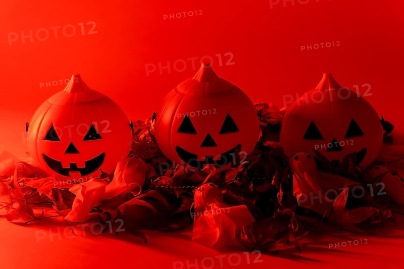 Halloween pumpkins on a red background
