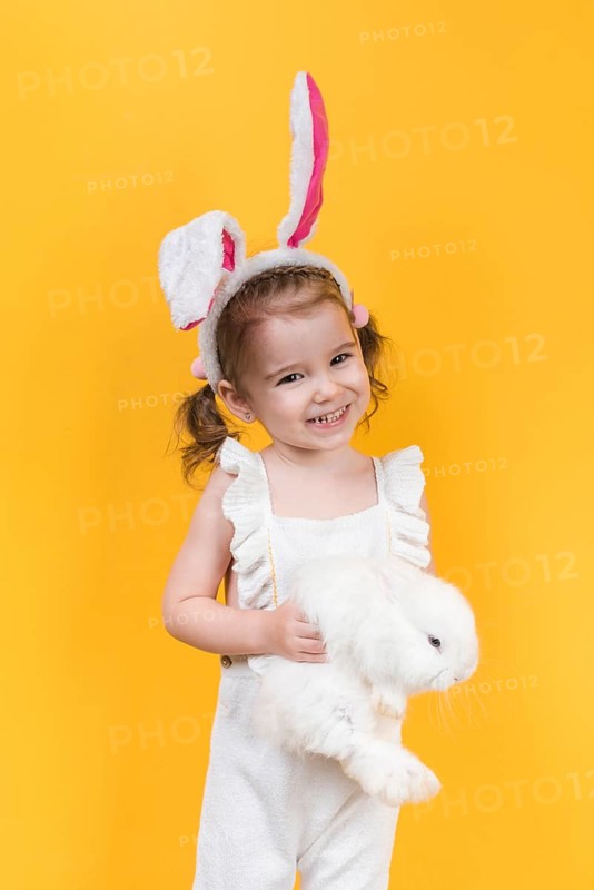 Cute girl bunny ears with rabbit