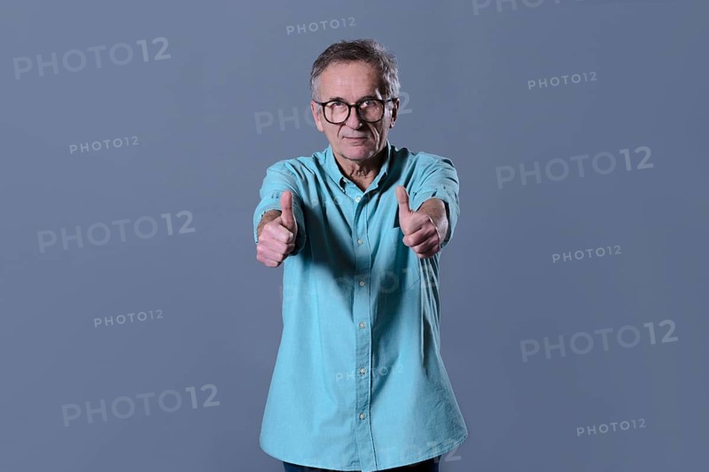 Man doing thumbs up gesture