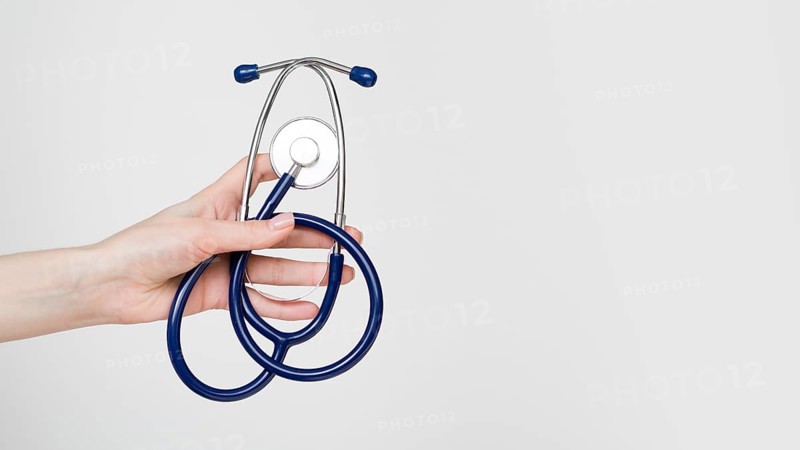 Close up hand holding stethoscope