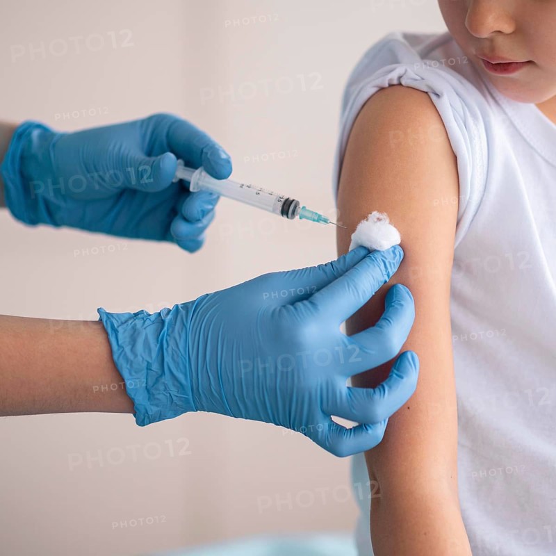 Little girl vaccinating coronavirus hospital