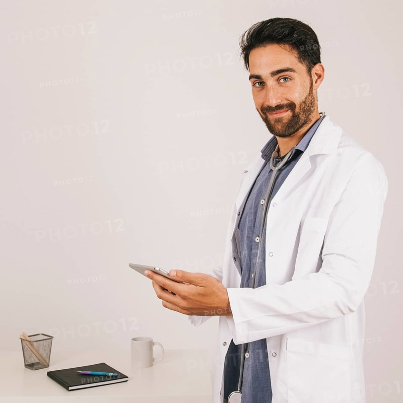 Happy medical doctor working with ipad