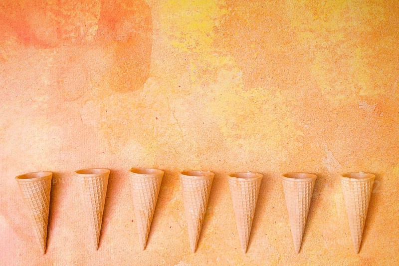 Waffle cones row multicolored background