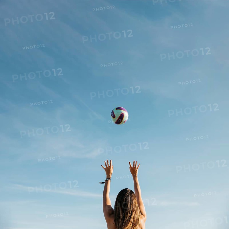 Woman playing volleyball beach