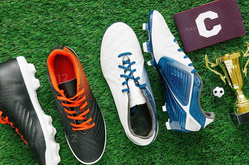 Football background grass with shoes