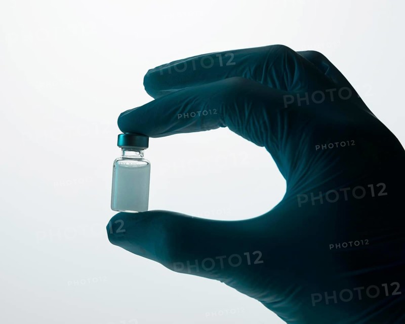 Doctor holding vaccine hand