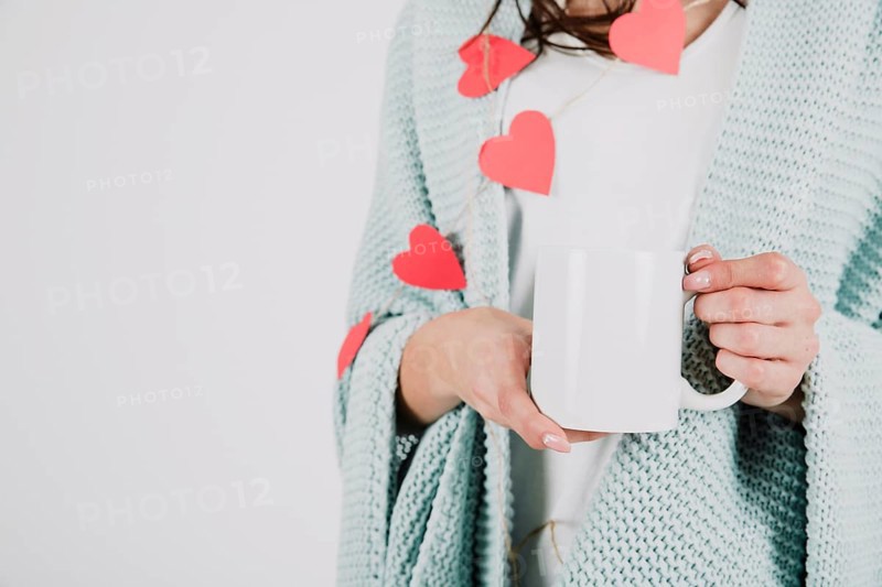 Crop woman plaid holding cup