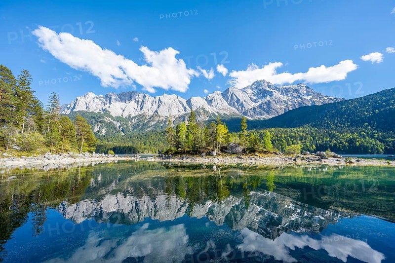 Zugspitze massif and Zugspitze reflected in Eibsee lake
