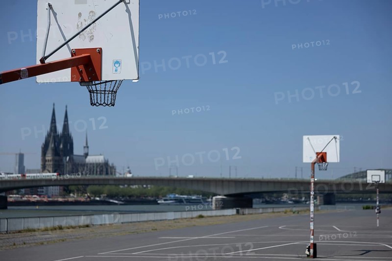 Basketball court on the banks of the Rhine in Deutz in front of the cathedral and Severinsbruecke