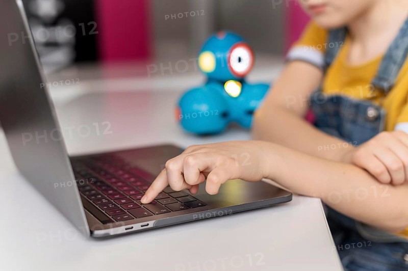 Kid typing keyboard
