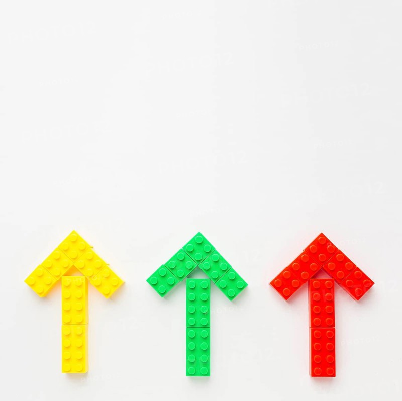 Top view colored toy arrows pointing up