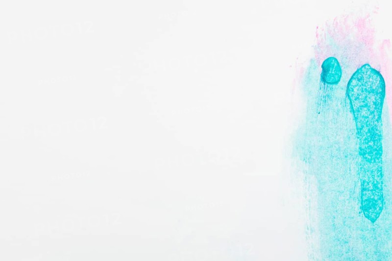 Smudged green pink colored white backdrop