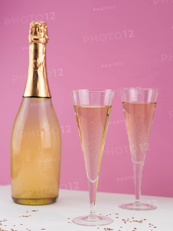 Champagne bottle with filled glasses